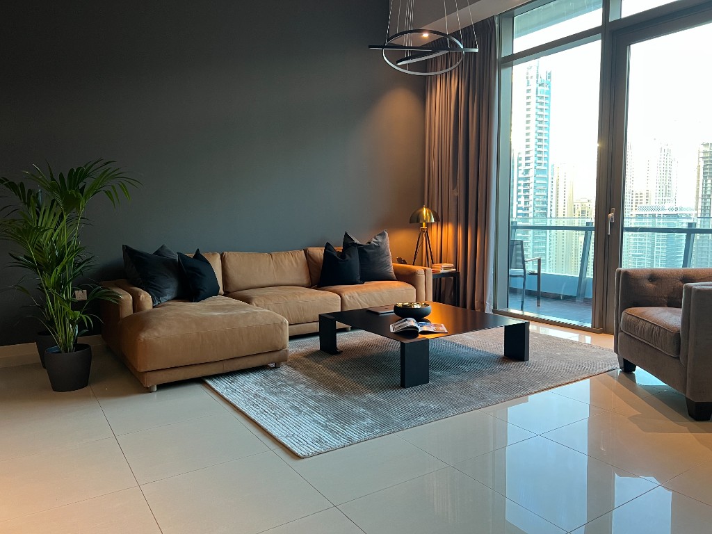 Furnished living room with city skyline view