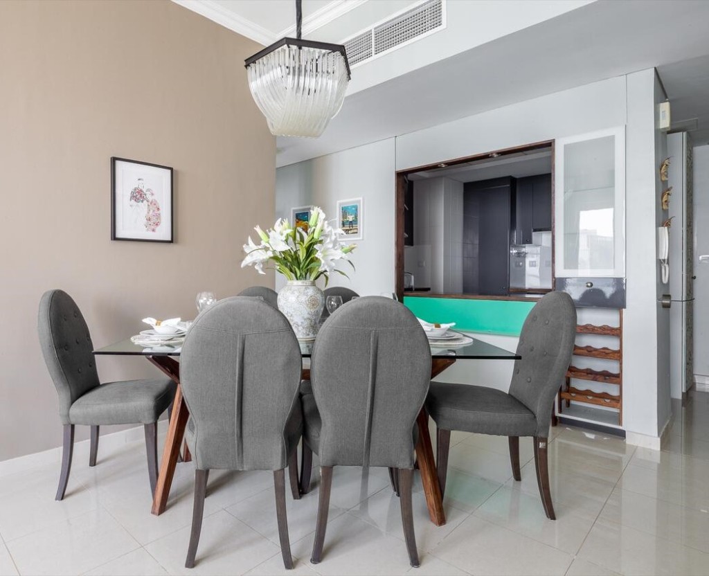 After — dining table with kitchen pass-through and turquoise accent